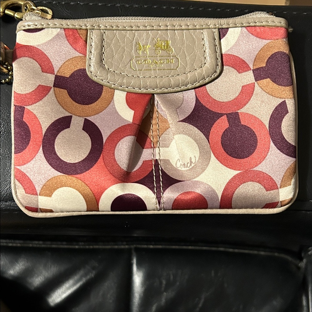 Coach Circle Pattern Wristlet in maroon and tan with hang tag